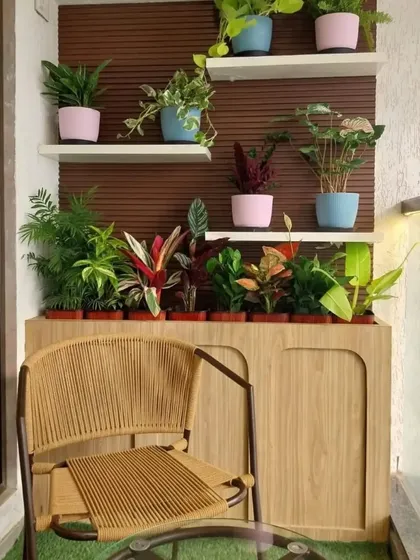 Another view of the no fuss green balcony we designed. The setup provides a perfect green backdrop for a morning cup of tea. Our goal is to create functional and aesthetic spaces where you can relax and connect with nature, even in a compact urban environment.