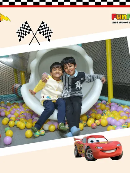 The pure joy of friendship and play! Two friends share a happy moment at the bottom of our slide, surrounded by a sea of colorful balls in the ball pit. This is what FunFizz is all about.