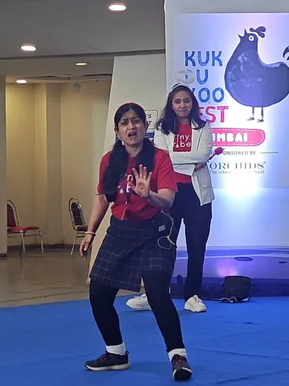 Two of our teachers performing a scene on stage. Their expressive faces and gestures tell a story all on their own, capturing the attention of the children sitting in the audience. This is storytelling in its most active form.