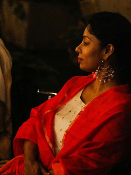 A guest enjoying a sold out evening of ghazals with Sanam Khan. The focus is on the music and the shared experience, a tribute to the masters of the genre.