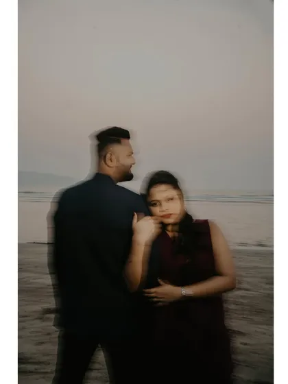 An artistic shot using motion blur to create a dreamy, ethereal effect for a beach portrait.