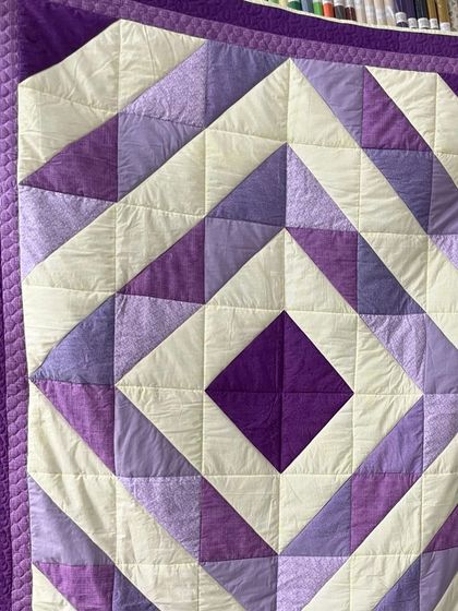 A close-up of the diamond quilt, showing the straight-line "stitch in the ditch" quilting.