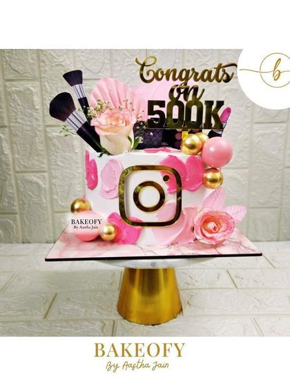 A 2kg truffle cake to celebrate a 500K milestone on Instagram. It's decorated with pink brushstrokes, an Instagram logo, and makeup-themed toppers.