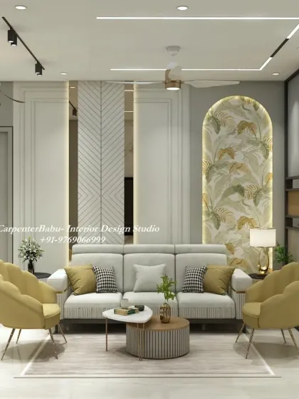 This living room uses pops of mustard yellow in the armchairs to brighten up the neutral space. The tropical-themed wallpaper in the arched niche adds a touch of nature-inspired art.