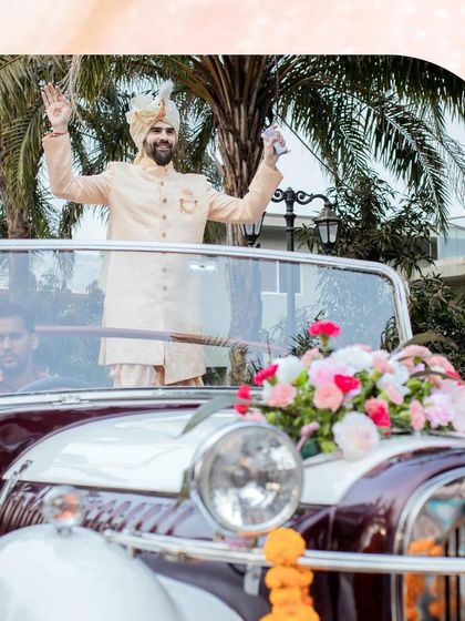 The groom's arrival in a classic vintage car, ready to get the party started. We handle all the logistics to ensure a stylish and seamless entry.
