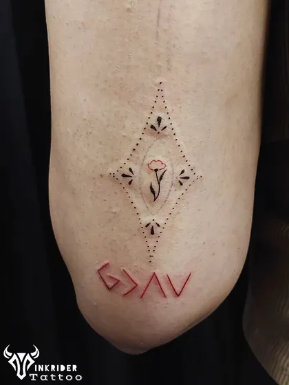 The phrase "God is greater than the highs and lows" represented by the minimalist symbol G>AV. We inked this one with a pop of red ink for a unique look.