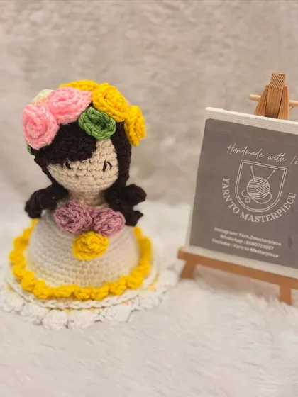 This is the doll form of the yellow-trimmed reversible bouquet. Her sweet, sleepy expression and a floral crown make her an adorable companion or decor piece.