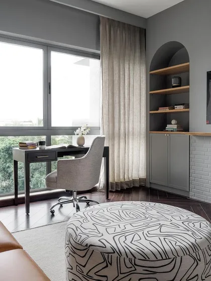 A home office space in the Weespaces project, featuring our custom-designed desk and an arched shelving unit.