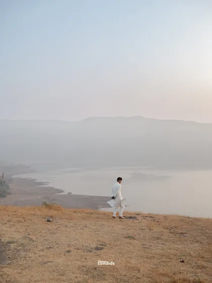 A solitary figure against a vast, misty landscape. This photo captures the feeling of being grounded yet searching, a key part of Maddy's journey before he reconnected with Kennesseia.