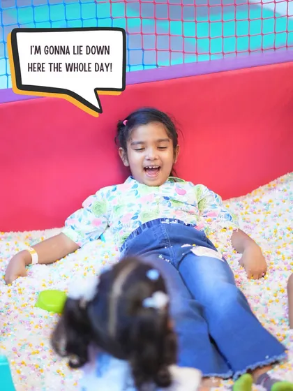Finding your happy place and just wanting to stay there all day. This girl is loving the soft, cushiony ball pit, and I can't blame her.