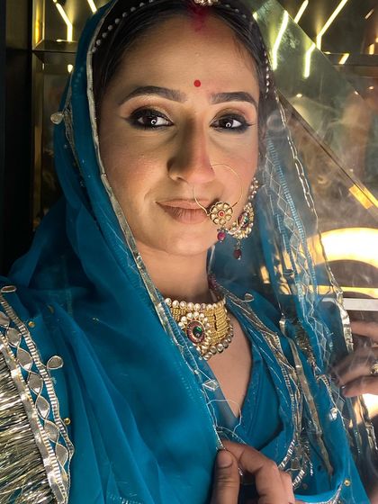 A portrait of our Rajasthani bride look, highlighting the detailed eye makeup and traditional bindi placement. We emphasize cultural nuances in our advanced bridal module.