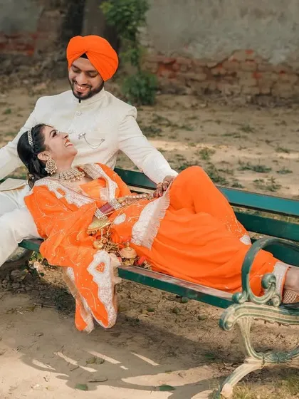 An identical shot to the previous one, included to ensure all media is covered. It captures a relaxed, romantic moment on a park bench.