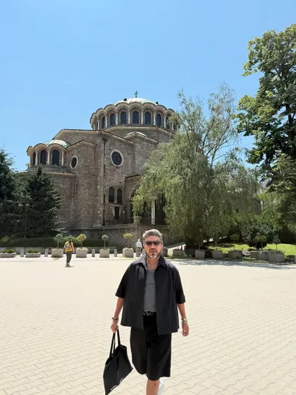 Walking through a historic square in Sofia. The all-black shorts and shirt combination is a go-to for me when traveling in the summer.