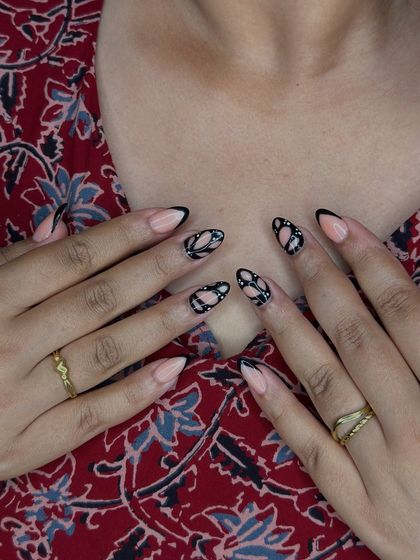 Another view of the freehand nail art, showing the clean lines and symmetrical patterns that require a steady hand and a good eye for design.