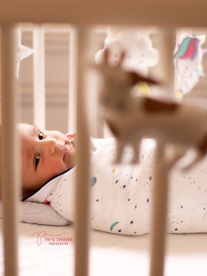 A slightly different perspective, focusing on the baby's curious gaze. Lifestyle photography is about finding the beauty in these small, ordinary moments.