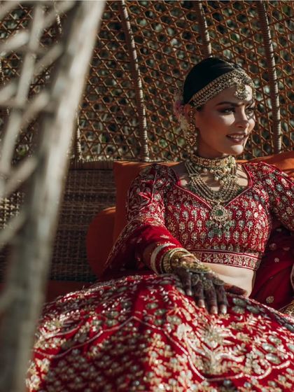 A stunning bride in her traditional red lehenga, a timeless and beautiful sight.