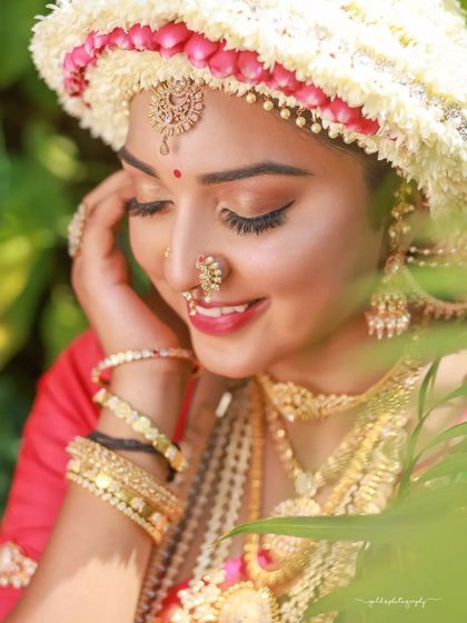 Close-up portraits focusing on the "Sharadha Jalli" hairstyle and bridal makeup. The ring light creates a beautiful, even glow, highlighting the intricate details and the model's features.