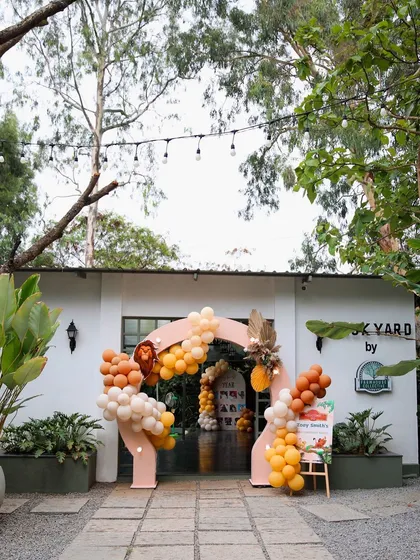 The entrance to The Backyard decorated for a "Lion King" themed birthday. The balloon arch and character cutouts create an exciting and fun welcome for the kids.