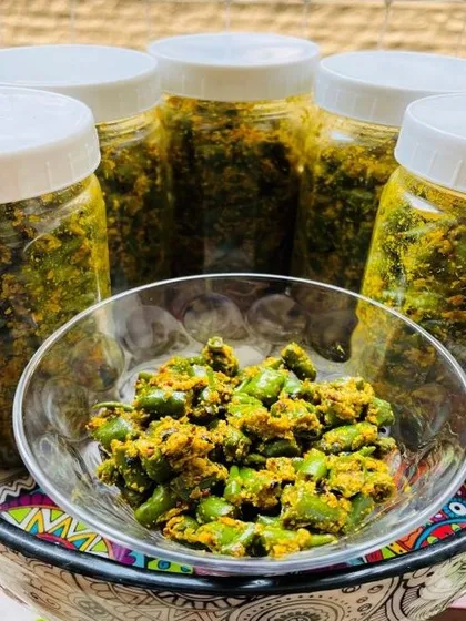 Jars of my green chili pickle, freshly made and bottled. This pickle is a simple way to spice up your daily meals and is a staple in many North Indian households.