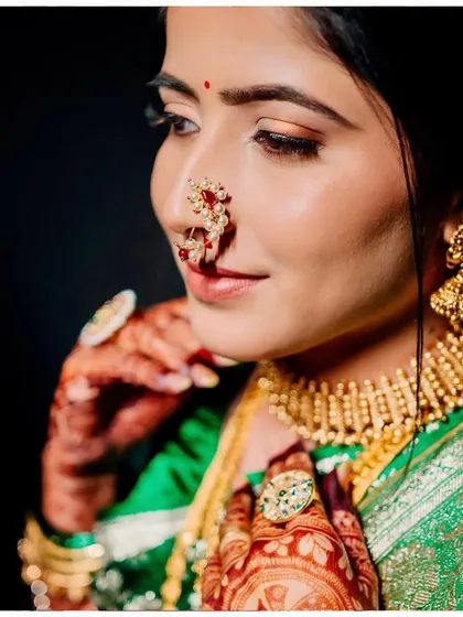 A close-up of Sanyukta's wedding look, featuring neutral tones and flawless skin. Can you guess how many hours apart this and the reception photo were taken?