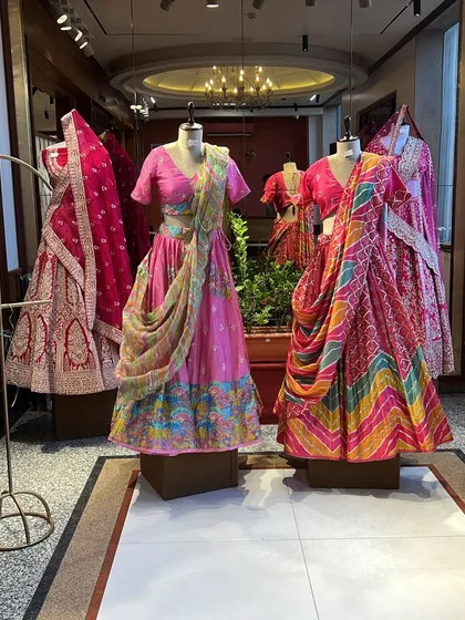 A display of vibrant bridal and festive lehengas at a store in Jaipur. The city is a hub for traditional craftsmanship with a modern twist.