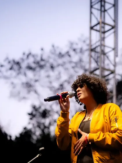 A solo moment during our set at Signature Green Vibes. Even on a big stage, I focus on delivering an emotive and personal vocal performance.