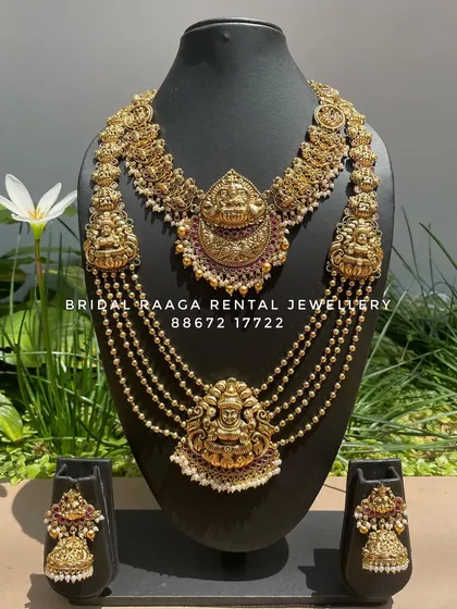 A stunning multi-layered temple necklace set. The top layer is a choker, followed by cascading beaded chains, creating a look of pure opulence.