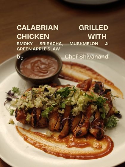 Another dish from our kitchen playground. Chef Shivanand's Calabrian Grilled Chicken with a smoky sriracha, muskmelon, and green apple slaw. A plate full of invention.