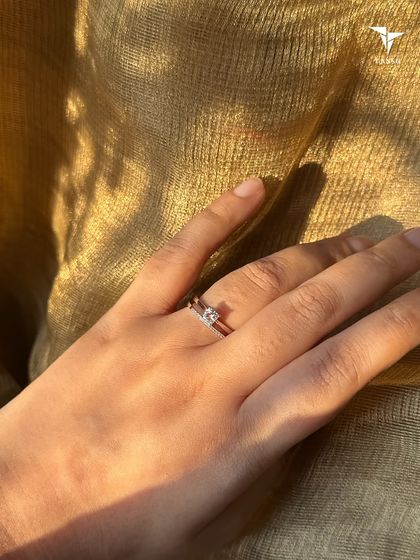 A more minimalist double band design with pavé accents, offering versatile and elegant style for everyday wear.