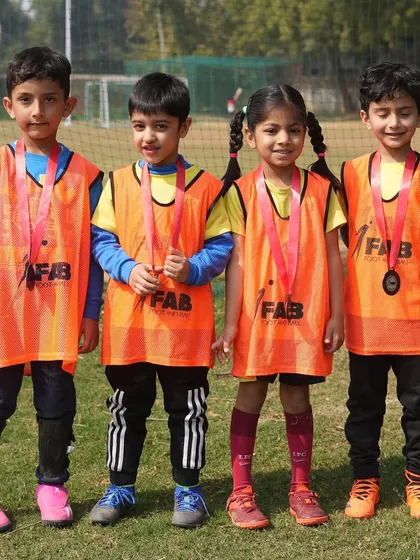 Four young players with their medals. We believe talent without hard work is nothing, and these players have worked hard.
