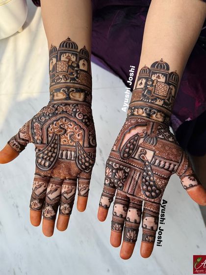 A beautiful design featuring royal elephants and palace architecture, created for the groom's family members.