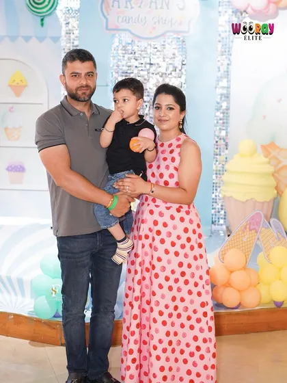 A beautiful family portrait at Aryan's "Candy Shop" themed birthday. We provide the perfect backdrop for capturing precious family memories.