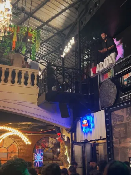 A wider angle of me on the elevated platform, showing the unique layout of the club.
