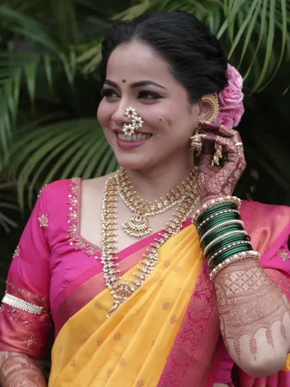 A candid, happy moment that shows off the bride's beautiful smile and flawless makeup.