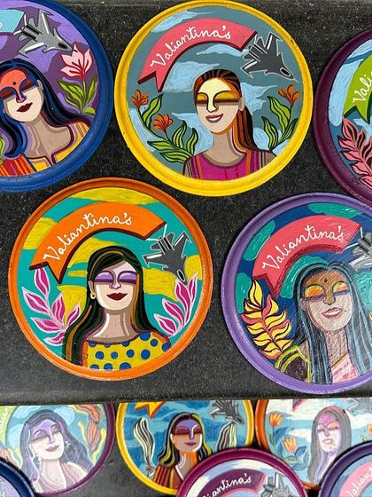 A closer look at the vibrant colors and details of the custom mini plates made for the squadron's farewell.