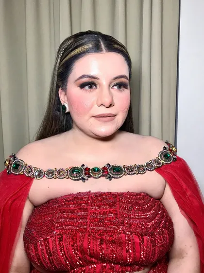 Another angle showcasing the beautiful makeup and the intricate details of the outfit.