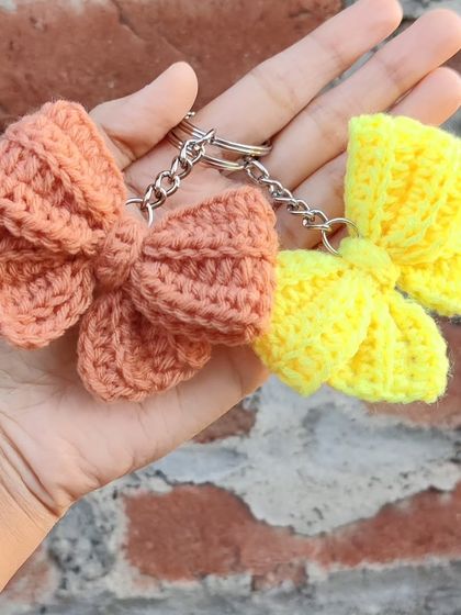 Coquette bow keychains available in a whole spectrum of colors, from bold reds and pinks to earthy tones.