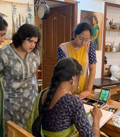 Students gather around an instructor for a demonstration. This collaborative learning and sharing of knowledge is a key part of the vibrant energy in our classroom.