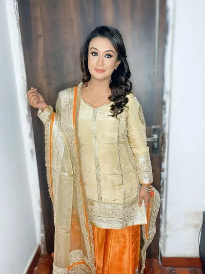 The full look for a satsang, where the makeup is polished and glowing, allowing her natural beauty to shine through.
