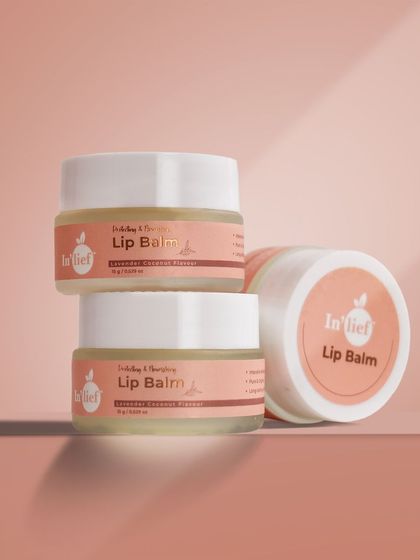 A stacked arrangement of In'lief lip balm jars. This type of shot is great for showing multiple product units or variations in a clean, organized way.