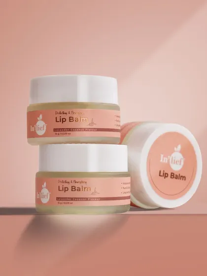 A stacked arrangement of In'lief lip balm jars. This type of shot is great for showing multiple product units or variations in a clean, organized way.