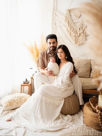A stunning family portrait in a boho setting, capturing the family's style and love.