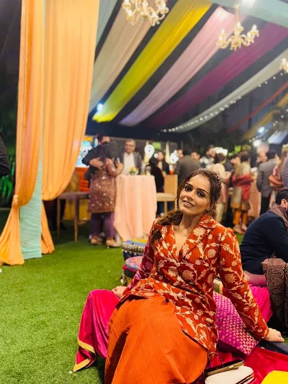 A smiling shot from the Lohri party. This outfit proves that you can stay true to tradition with fabrics like Banarasi silk while embracing modern cuts like a dhoti and jacket set.
