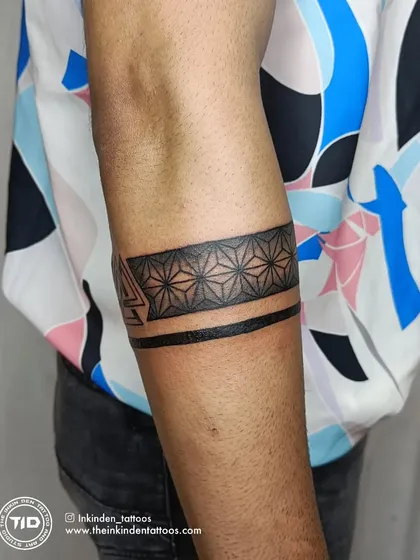 The back of the travel-themed armband tattoo.