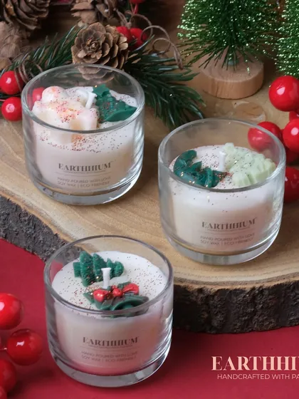 A set of three 'Christmas in a Jar' candles, perfect for a festive display.