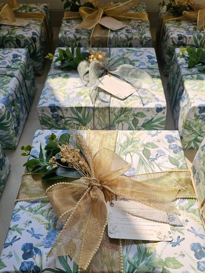 A look at the two different ribbon styles I used for these wedding favors. One is a sheer grey, and the other is a shimmering gold, offering two distinct but equally elegant finishes.