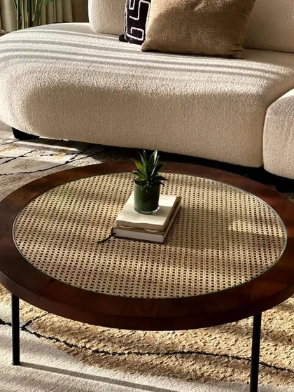 This center table combines a classic dark wood frame and natural cane weaving, protected by a layer of glass. It’s a perfect example of how we blend timeless materials with modern design for a piece that is both beautiful and practical for everyday use.