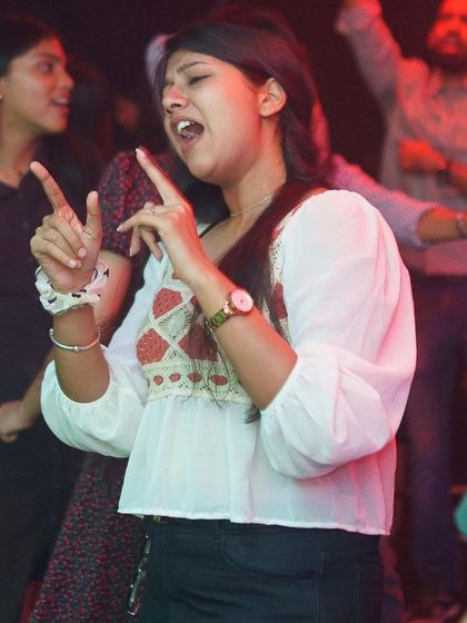 Singing along to every word. It's amazing to see the crowd connect with the music so much.