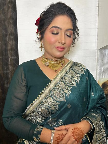 Keeping it subtle and simple. This client wanted a soft look for a party, so I gave her a golden shimmer on the eyes and a natural base.