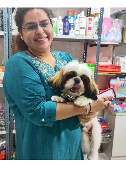 The joy on a pet parent's face says it all. We love seeing our clients happy with their pampered pooch after a visit to our in-house salon.